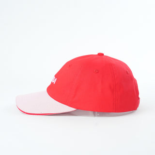Red and white baseball cap on a white background