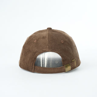 Brown cap with a reflective patch on a white background