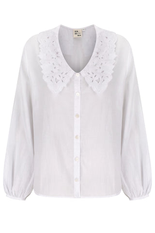 White blouse with lace details on a white background