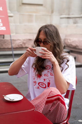 girl wearing with tshirt drinking coffee