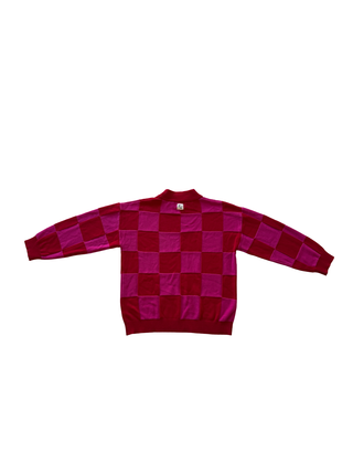 Red and purple checkered sweater on a white background
