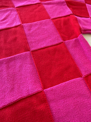 Close-up of a pink and red checkered fabric pattern