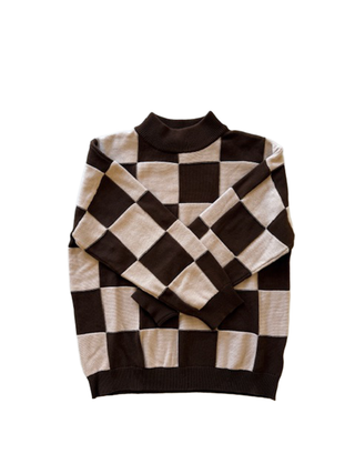 Checkered sweater with black and beige pattern on a white background