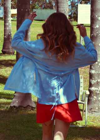 Girl wearing red mini skirt and blue shirt