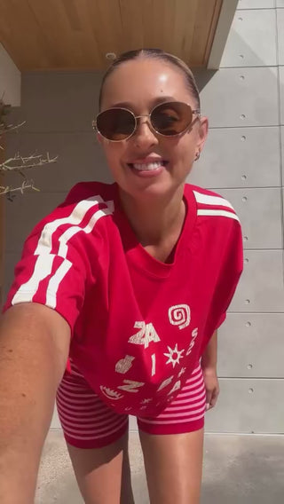 Woman trying on a red tshirt