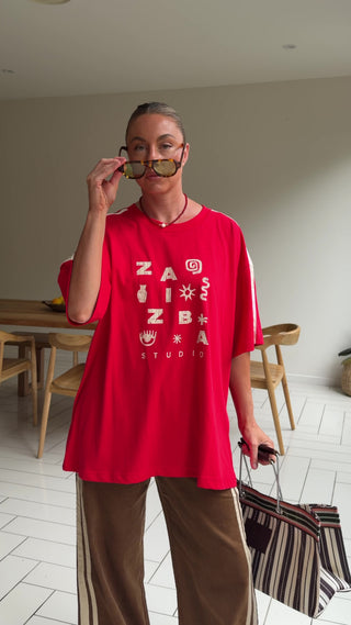 Woman trying on a red tshirt