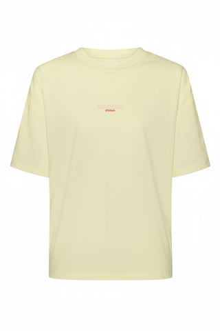 Light yellow t-shirt with a small red logo on a white background